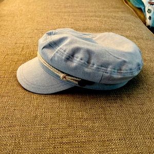 Blue hat/cap with white rope and brass details